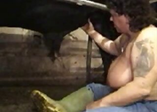 Fat lady with saggy boobs stuffing her mouth full of horse cock